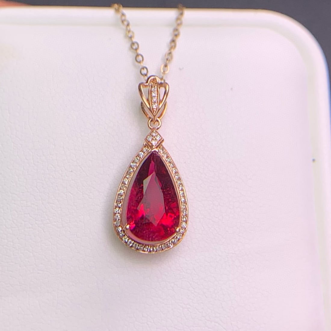 14k Gold 3.3 Ct Natural Tourmaline & Diamond Pendant( Without Chain ): Ref:231038337 // gold content:14k gold // main gemstone:tourmaline // shape:pear // carat weight:3. 3ct // color:red // treatment:natural // // adjacent gemstone 2 : diamond // shape:round // clarity