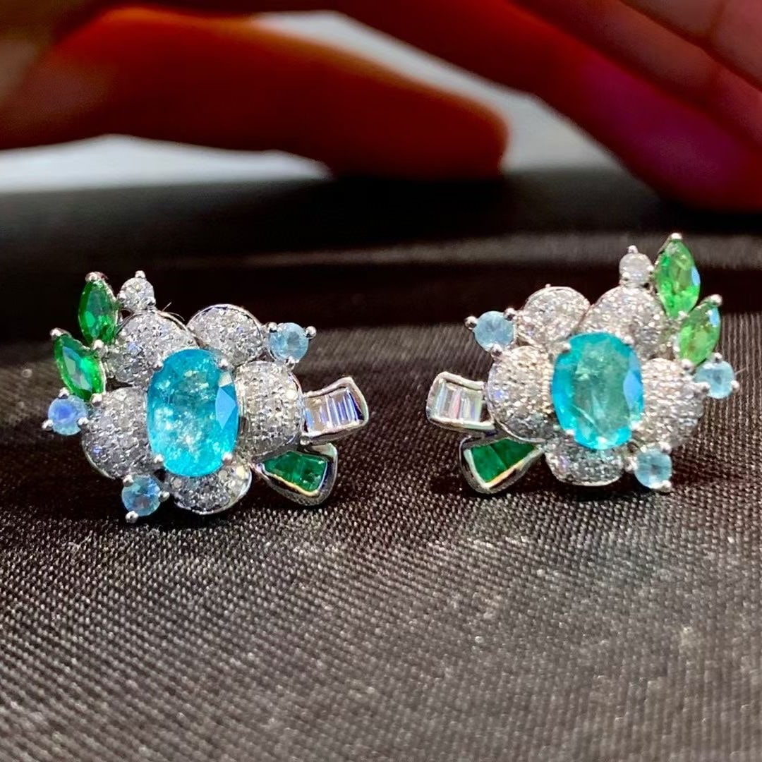 14k Gold 1.1 Ct Natural Paraiba Tourmaline & Diamond Earrings: Ref:231038347 // gold content:14k gold // main gemstone:paraiba tourmaline // shape:oval // carat weight:1. 1ct // color:blue // treatment:natural // // adjacent gemstone 2 : diamond // shape:round //