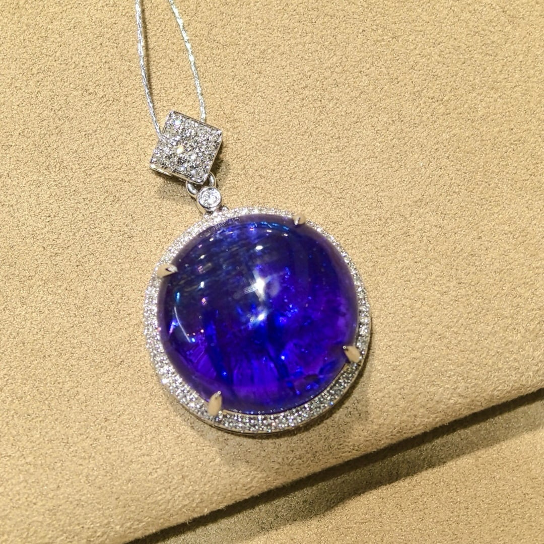 14k Gold 16.61 Ctw Natural Tanzanite & Diamond Pendant( Without Chain ): Ref:231038425 // gold content:14k gold // main gemstone:tanzanite // shape:round // carat weight:16. 25ct // color:blue // treatment:natural // cut grade:g // // adjacent gemstone 2 : diamond //