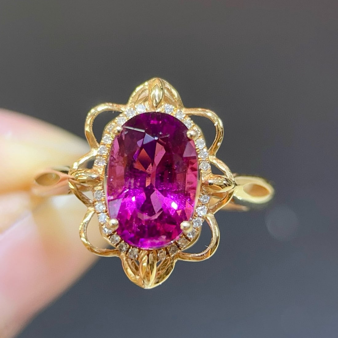 14k Gold 2.36 Ctw Natural Tourmaline & Diamond Ring: Ref:231038443 // gold content:14k gold // ring size:7. 25us // // main gemstone:tourmaline // shape:oval // carat weight:2. 25ct // color:red // treatment:natural // // adjacent gemstone 2 : diamond