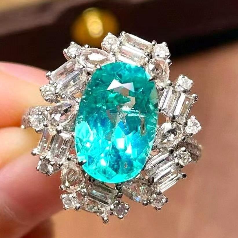 14k Gold 4.50 Ctw Natural Paraiba Tourmaline & Diamond & Sapphire Ring: Ref:231039002 // gold content:14k gold // ring size:7. 25us // // main gemstone:paraiba tourmaline // shape:oval // carat weight:3. 44ct // color:blue // treatment:natural // // adjacent gemstone 2 : 