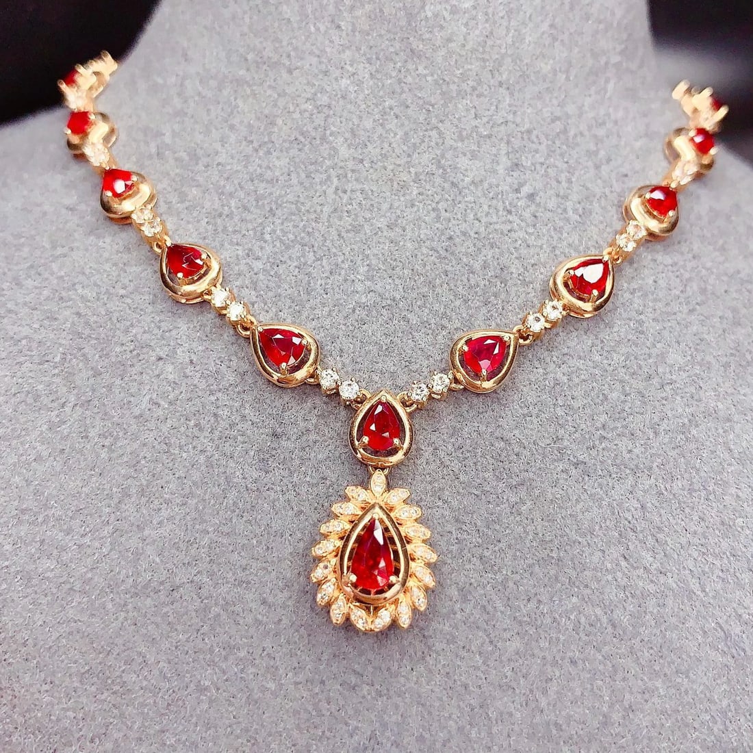 14k Gold 6 Ct Natural Ruby & Diamond & Sapphire Necklace: Ref:231039004 // gold content:14k gold // main gemstone:ruby // shape:pear // carat weight:6ct // color:red // treatment:natural // // adjacent gemstone 2 : diamond // number of stones:34 // shape:rou