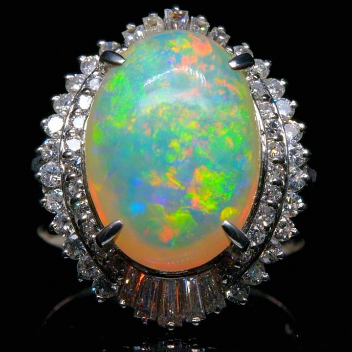 14k Gold 5.44 Ctw Natural Opal & Diamond Ring: Ref:231039017 // gold content:14k gold // ring size:7. 25us // // main gemstone:opal // shape:oval // carat weight:4. 51ct // color:color // treatment:natural // // adjacent gemstone 2 : diamond // sh