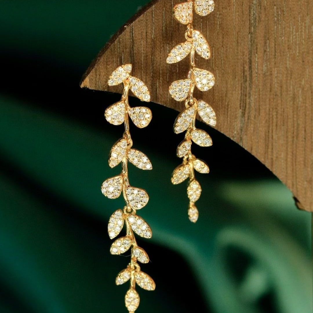 14k Gold 0.6 Ct Natural H Diamond Earrings: Ref:231039033 // gold content:14k gold // main gemstone:diamond // shape:round // carat weight:0. 6ct // clarity grade:vs-si // color:h // treatment:natural // cut grade:g // Condition: New Low Estima