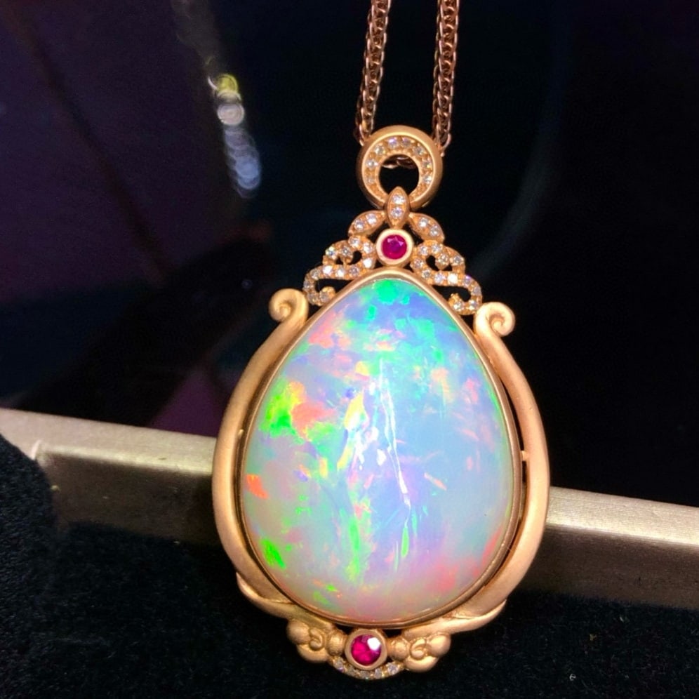 14k Gold 29 Ct Natural Opal & Diamond Pendant( Without Chain ): Ref:231039042 // gold content:14k gold // main gemstone:opal // shape:pear // carat weight:29ct // color:white // treatment:natural // // adjacent gemstone 2 : diamond // number of stones:43 //