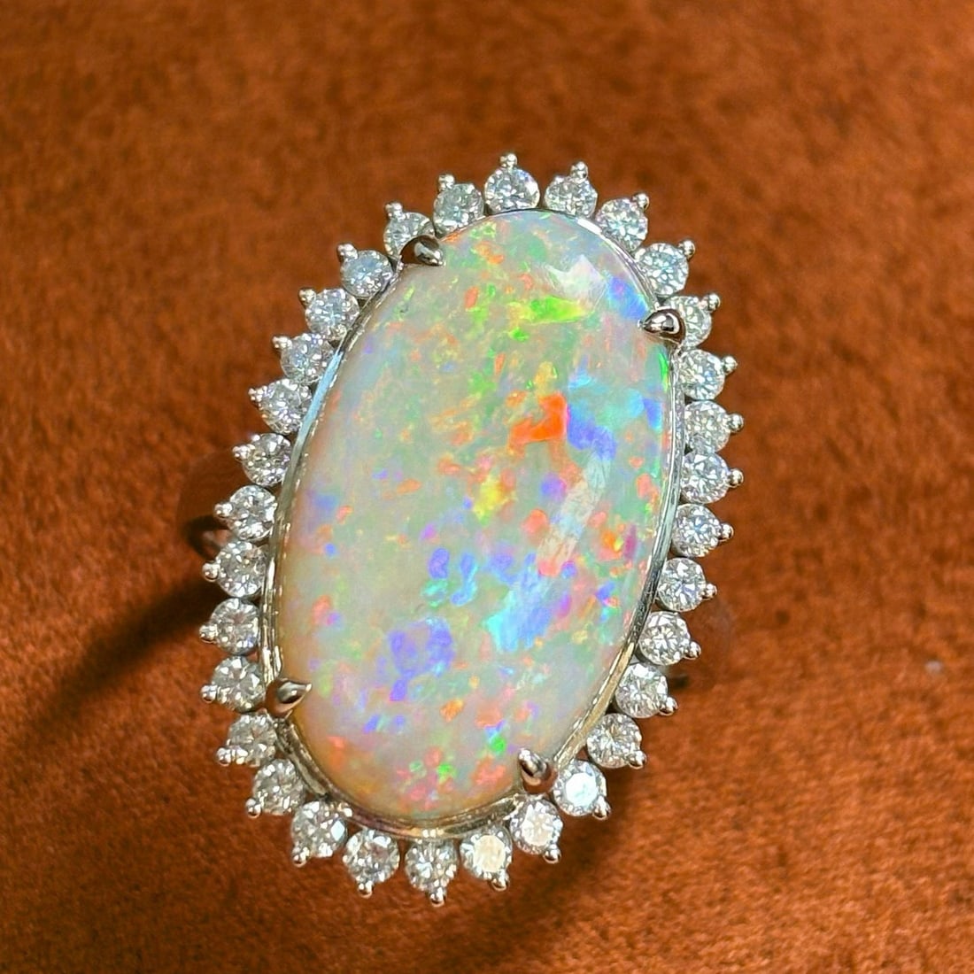 14k Gold 6.36 Ctw Natural Opal & Diamond Ring: Ref:231039087 // gold content:14k gold // ring size:7. 25us // // main gemstone:opal // shape:oval // carat weight:5. 65ct // color:white // treatment:natural // // adjacent gemstone 2 : diamond // sh