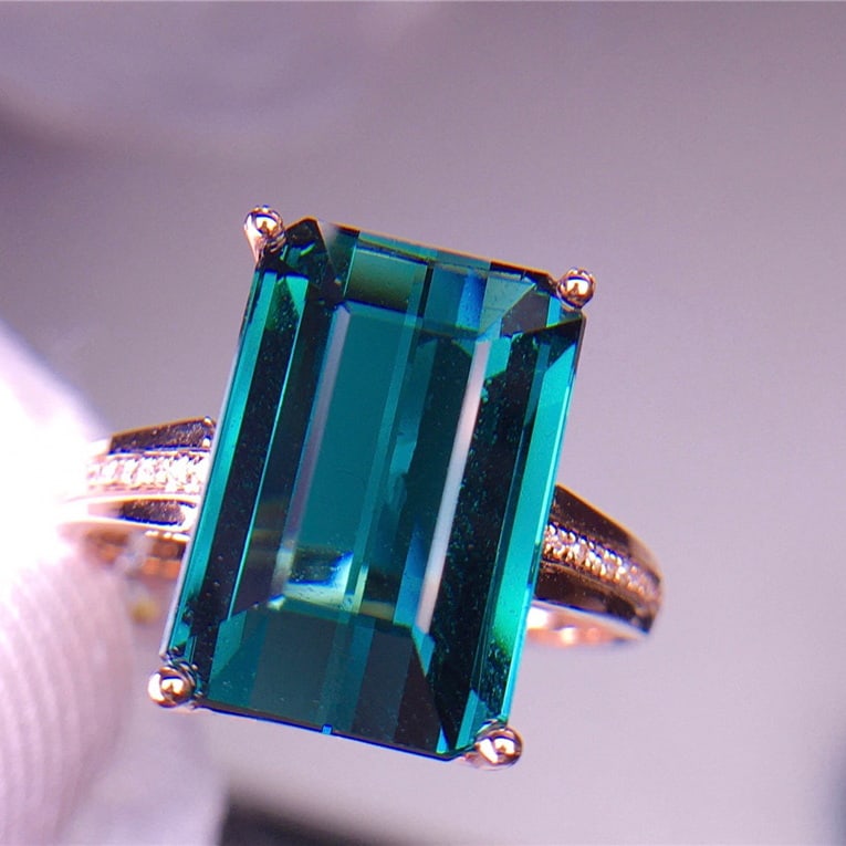 14k Gold 7 Ct Natural Tourmaline & Diamond Ring: Ref:231039088 // gold content:14k gold // ring size:7. 25us // // main gemstone:tourmaline // shape:octagonal // carat weight:7ct // color:blue // treatment:natural // // adjacent gemstone 2 : diamond