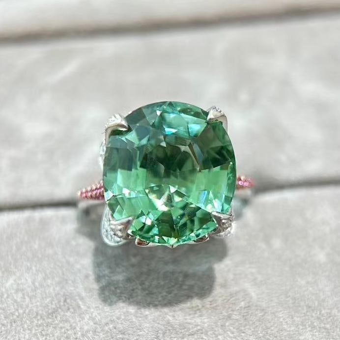 14k Gold 12.19 Ctw Natural Tourmaline & Diamond Ring: Ref:231039094 // gold content:14k gold // ring size:7. 25us // // main gemstone:tourmaline // shape:oval // carat weight:11. 58ct // color:mint green // treatment:natural // // adjacent gemstone 2 :