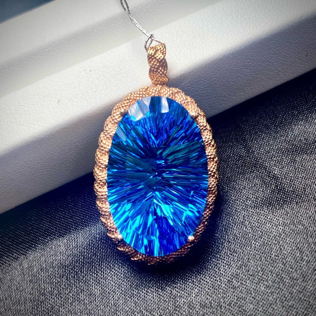 14k Gold 28.15 Ct Natural Topaz Pendant( Without Chain ): Ref:231039100 // gold content:14k gold // main gemstone:topaz // shape:oval // carat weight:28. 15ct // color:blue // treatment:natural // Condition: New Low Estimate: 2600.00 High Estimate: 3800.00