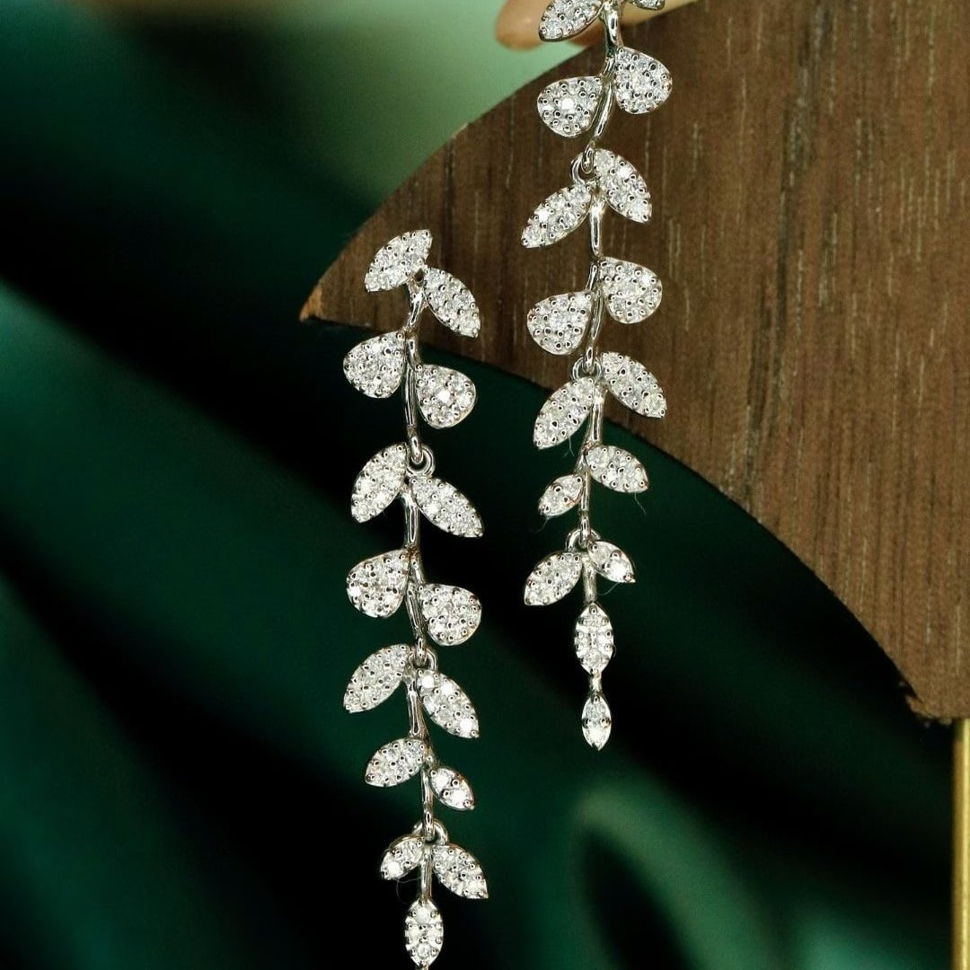14k Gold 0.6 Ct Natural H Diamond Earrings: Ref:231039121 // gold content:14k gold // main gemstone:diamond // shape:round // carat weight:0. 6ct // clarity grade:vs-si // color:h // treatment:natural // cut grade:g // Condition: New Low Estima