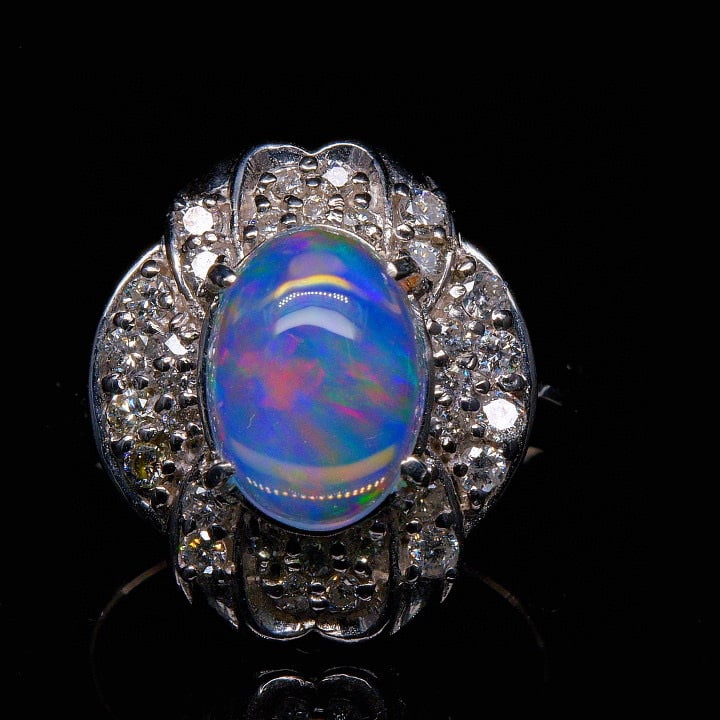 14k Gold 2.88 Ctw Natural Opal & Diamond Ring: Ref:231039126 // gold content:14k gold // ring size:7. 25us // // main gemstone:opal // shape:oval // carat weight:2. 21ct // color:color // treatment:natural // // adjacent gemstone 2 : diamond // sh