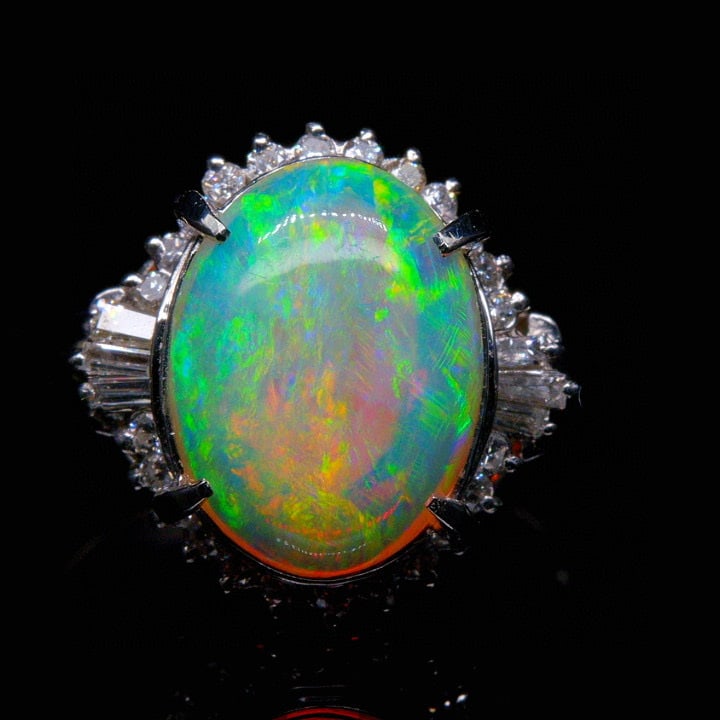 14k Gold 2.94 Ctw Natural Opal & Diamond Ring: Ref:231039127 // gold content:14k gold // ring size:7. 25us // // main gemstone:opal // shape:oval // carat weight:2. 61ct // color:color // treatment:natural // // adjacent gemstone 2 : diamond // sh