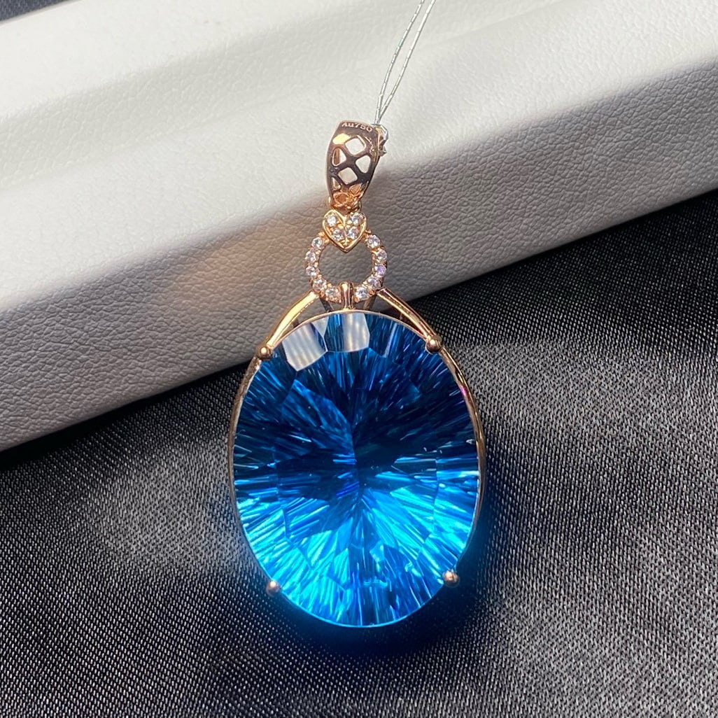 14k Gold 29.3 Ct Natural Topaz & Diamond Pendant( Without Chain ): Ref:231039213 // gold content:14k gold // main gemstone:topaz // shape:oval // carat weight:29. 3ct // color:blue // treatment:natural // // adjacent gemstone 2 : diamond // number of stones:14 //