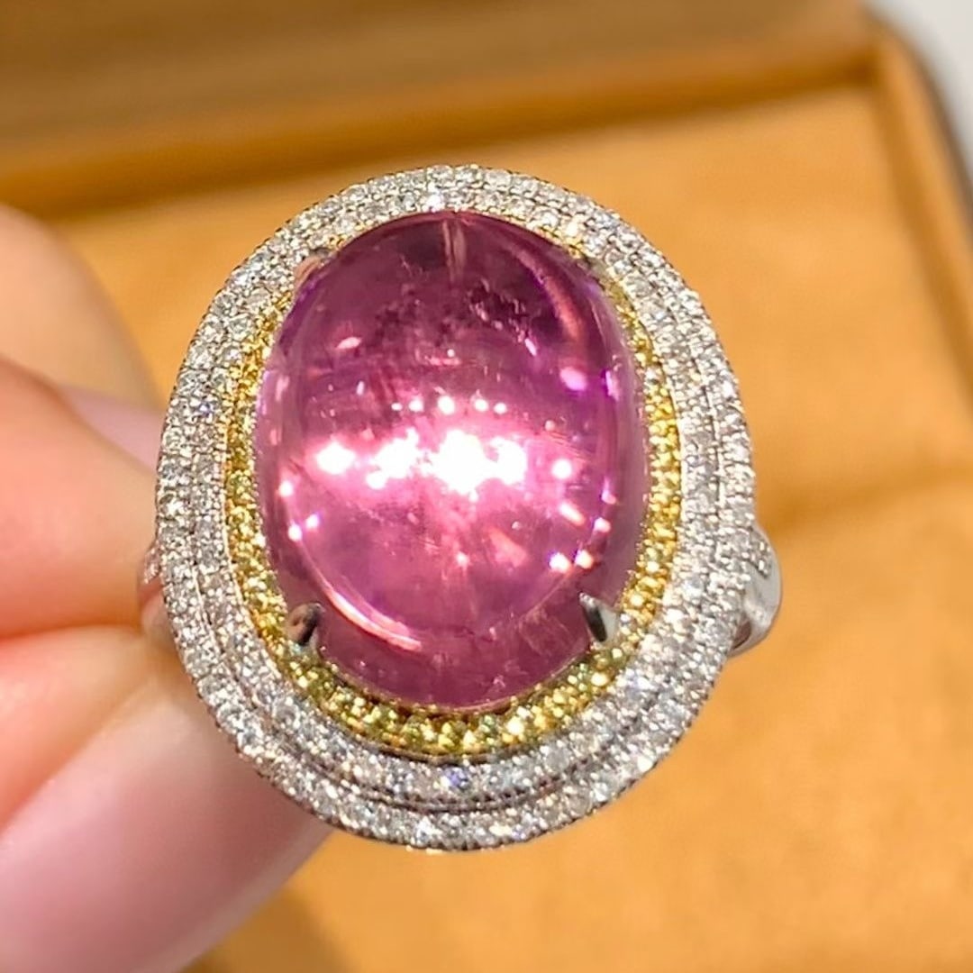 14k Gold 6.2 Ct Natural Tourmaline & Diamond Ring: Ref:231039220 // gold content:14k gold // ring size:7. 25us // // main gemstone:tourmaline // shape:oval // carat weight:6. 2ct // color:purplish red // treatment:natural // // adjacent gemstone 2 :