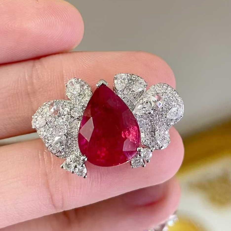 14k Gold 5.6 Ct Natural Tourmaline & Diamond Ring: Ref:231039221 // gold content:14k gold // ring size:7. 25us // // main gemstone:tourmaline // shape:pear // carat weight:5. 6ct // color:rubellite // treatment:natural // // adjacent gemstone 2 :