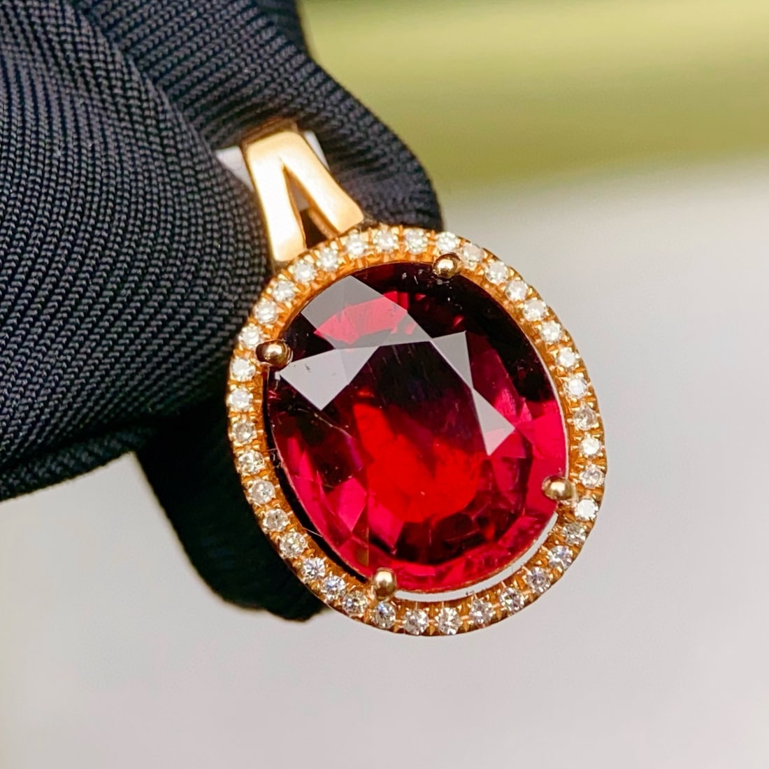 14k Gold 2.96 Ctw Natural Tourmaline & Diamond Pendant( Without Chain ): Ref:231039224 // gold content:14k gold // main gemstone:tourmaline // shape:oval // carat weight:2. 85ct // color:red // treatment:natural // // adjacent gemstone 2 : diamond // number of stones:38