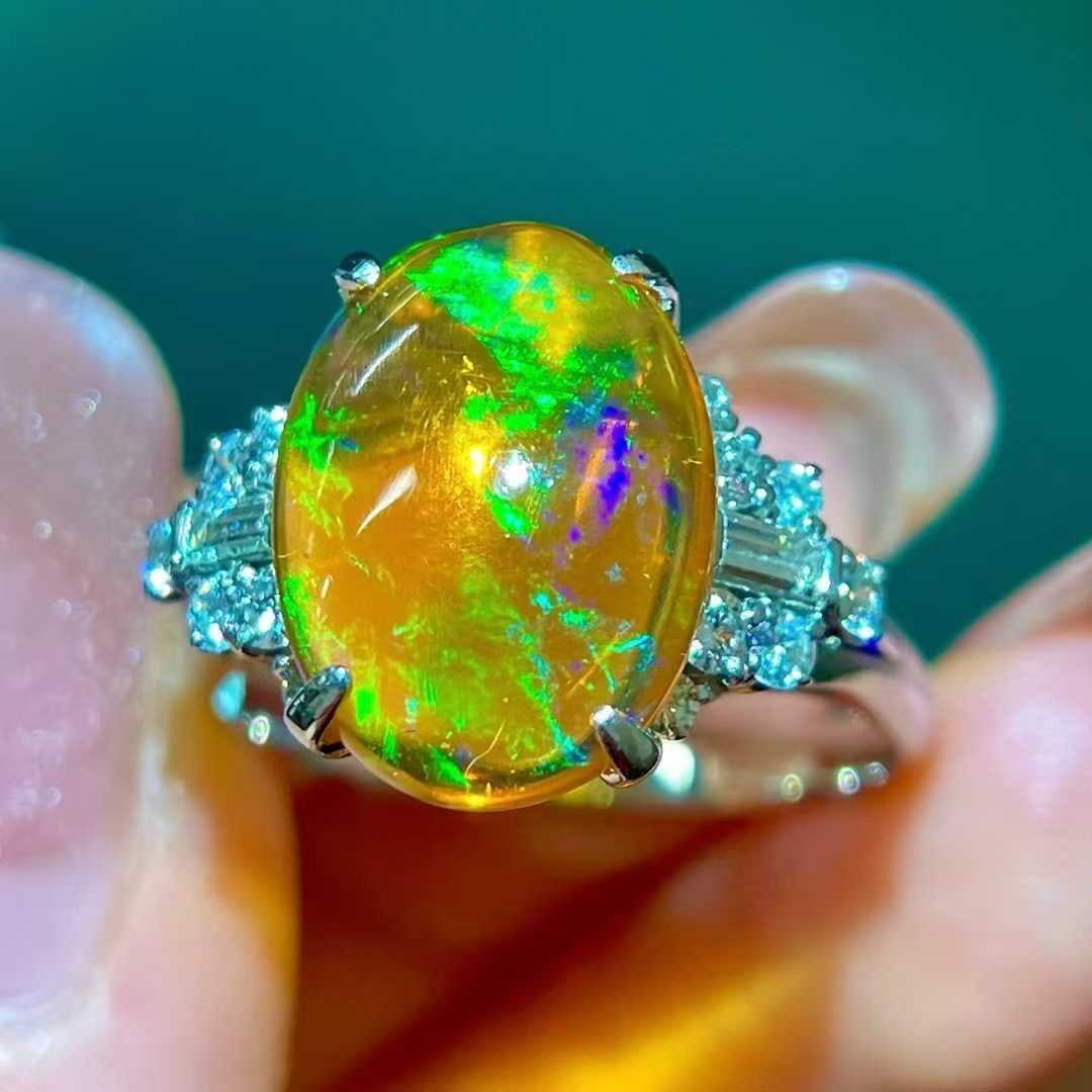 14k Gold 4.63 Ctw Natural Opal & Diamond Ring: Ref:231040082 // gold content:14k gold // ring size:7. 25us // // main gemstone:opal // shape:oval // carat weight:4. 12ct // color:color // treatment:natural // // adjacent gemstone 2 : diamond //