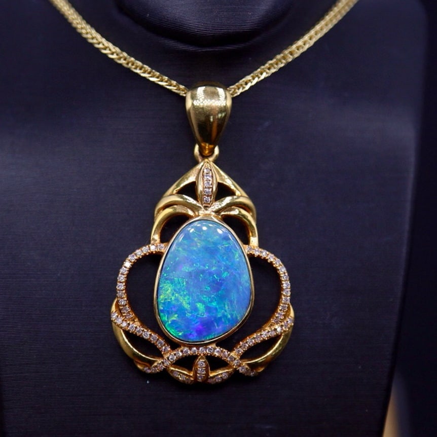14k Gold 2.88 Ct Natural Opal & Diamond Pendant( Without Chain ): Ref:231040084 // gold content:14k gold // main gemstone:opal // shape:other // carat weight:2. 88ct // color:color // treatment:natural // // adjacent gemstone 2 : diamond // number of stones:75 //