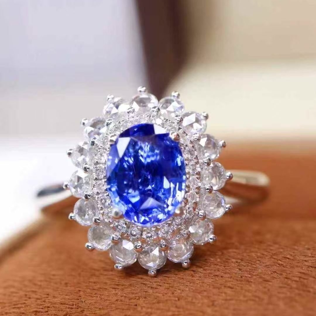 14k Gold 1.06 Ctw Natural Sapphire & Diamond Ring: Ref:231040273 // gold content:14k gold // ring size:7. 25us // // main gemstone:sapphire // shape:oval // carat weight:0. 76ct // color:cornflower blue // treatment:natural // // adjacent gemstone 2