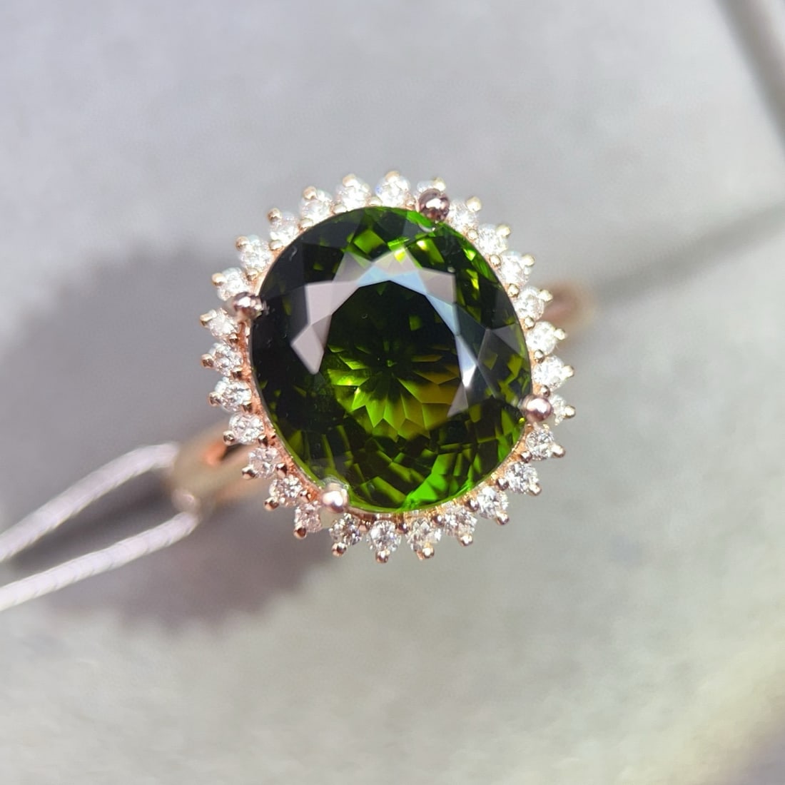 14k Gold 6.36 Ctw Natural Tourmaline & Diamond Ring: Ref:231040288 // gold content:14k gold // ring size:7. 25us // // main gemstone:tourmaline // shape:oval // carat weight:6. 08ct // color:green // treatment:natural // // adjacent gemstone 2 : diamond