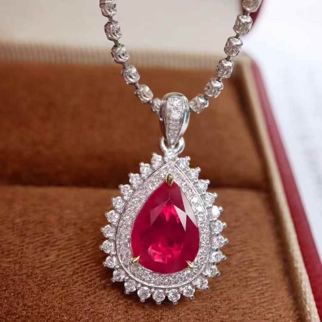 14k Gold 1.41 Ctw Natural Ruby & Diamond Pendant( Without Chain ): Ref:231040318 // gold content:14k gold // main gemstone:ruby // shape:pear // carat weight:1. 10ct // color:red // treatment:natural // // adjacent gemstone 2 : diamond // shape:round // carat weight: