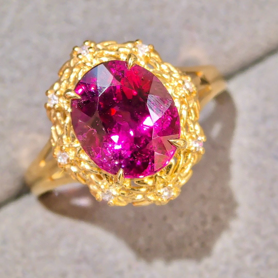 14k Gold 3.47 Ctw Natural Tourmaline & Diamond Ring: Ref:231040378 // gold content:14k gold // ring size:7. 25us // // main gemstone:tourmaline // shape:oval // carat weight:3. 41ct // color:red // treatment:natural // // adjacent gemstone 2 : diamond