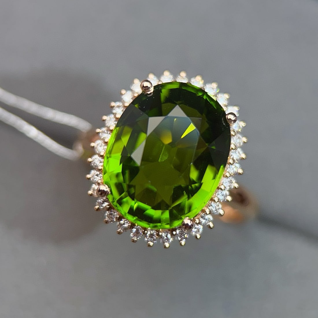 14k Gold 8.22 Ctw Natural Tourmaline & Diamond Ring: Ref:231040420 // gold content:14k gold // ring size:7. 25us // // main gemstone:tourmaline // shape:oval // carat weight:7. 9ct // color:green // treatment:natural // // adjacent gemstone 2 : diamond 