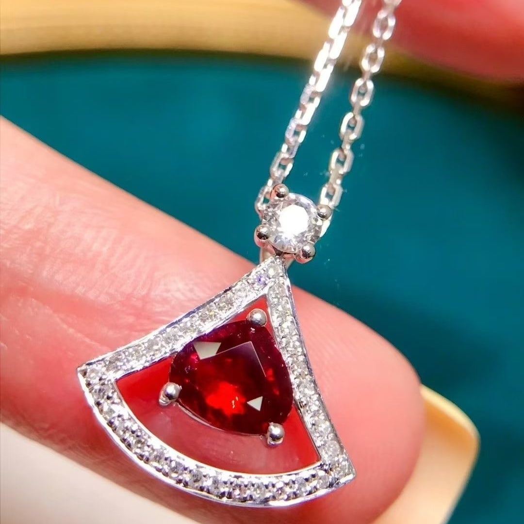 14k Gold 0.65 Ct Natural Ruby & Diamond & Sapphire Necklace: Ref:231040443 // gold content:14k gold // main gemstone:ruby // shape:pear // carat weight:0. 65ct // color:pigeonblood red // treatment:natural // // adjacent gemstone 2 : diamond // number of