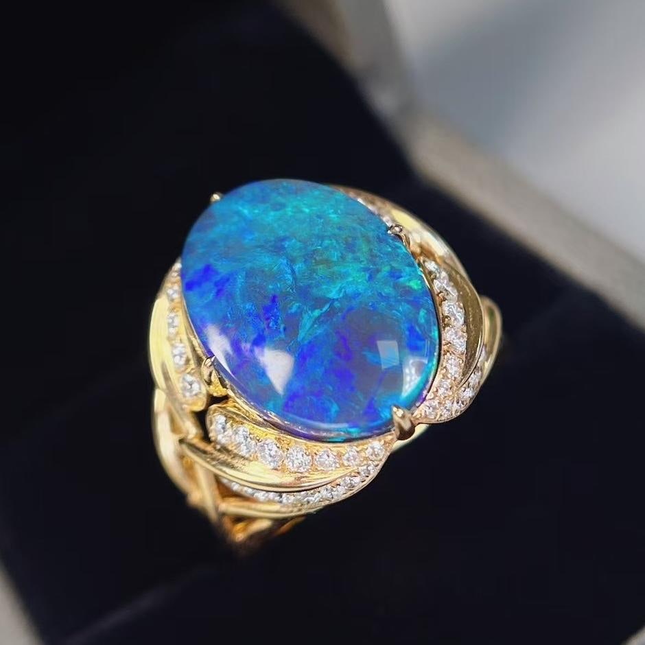 14k Gold 7.25 Ctw Natural Opal & Diamond Ring: Ref:231043017 // gold content:14k gold // ring size:7. 25us // // main gemstone:opal // shape:oval // carat weight:6. 23ct // color:blue // treatment:natural // // adjacent gemstone 2 : diamond //
