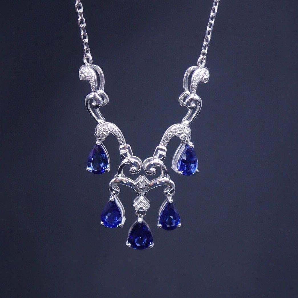 14k Gold 4.2 Ct Natural Sapphire & Diamond Necklace: Ref:231043023 // gold content:14k gold // main gemstone:sapphire // shape:pear // carat weight:4. 2ct // color:blue // treatment:natural // // adjacent gemstone 2 : diamond // number of stones:37 // s