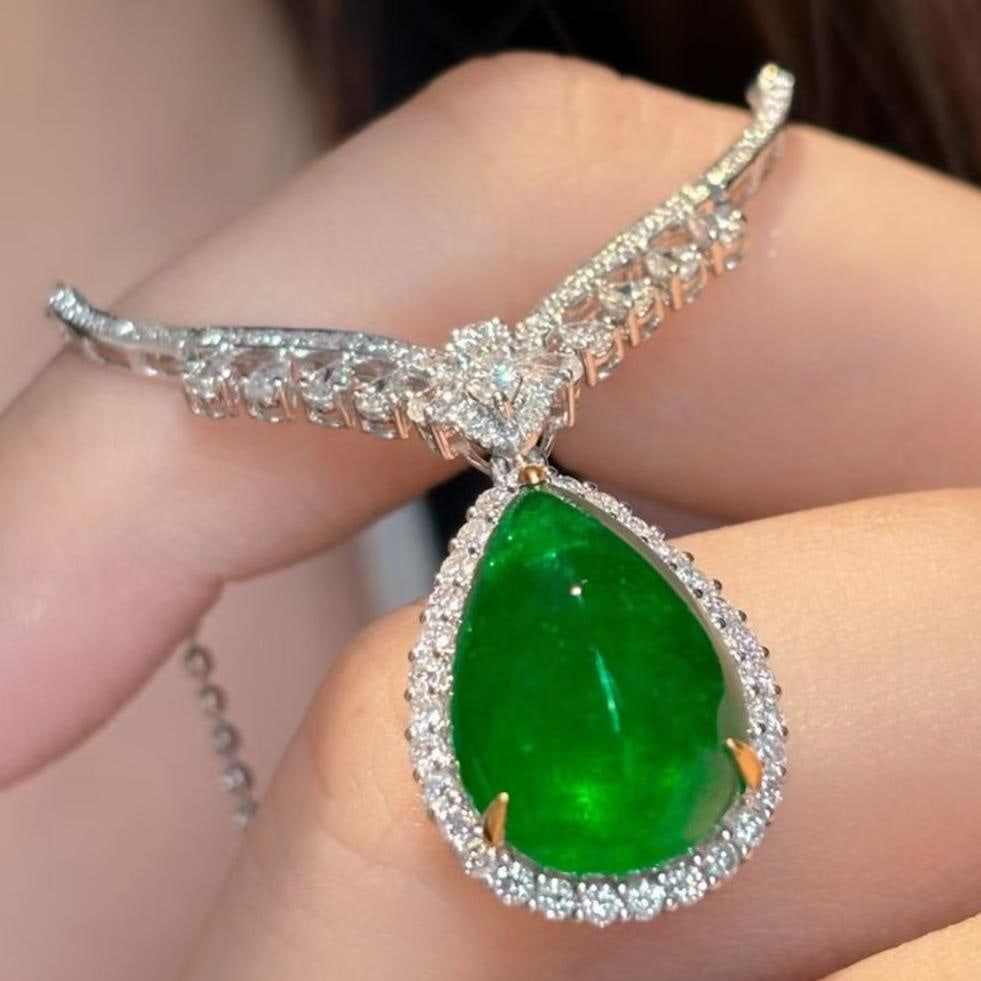 14k Gold 8.5 Ct Vivid Green Natural Emerald & Diamond Necklace: Ref:231043026 // gold content:14k gold // main gemstone:emerald // shape:pear // carat weight:8. 5ct // color:vivid green // treatment:natural // // adjacent gemstone 2 : diamond // shape:round // cla