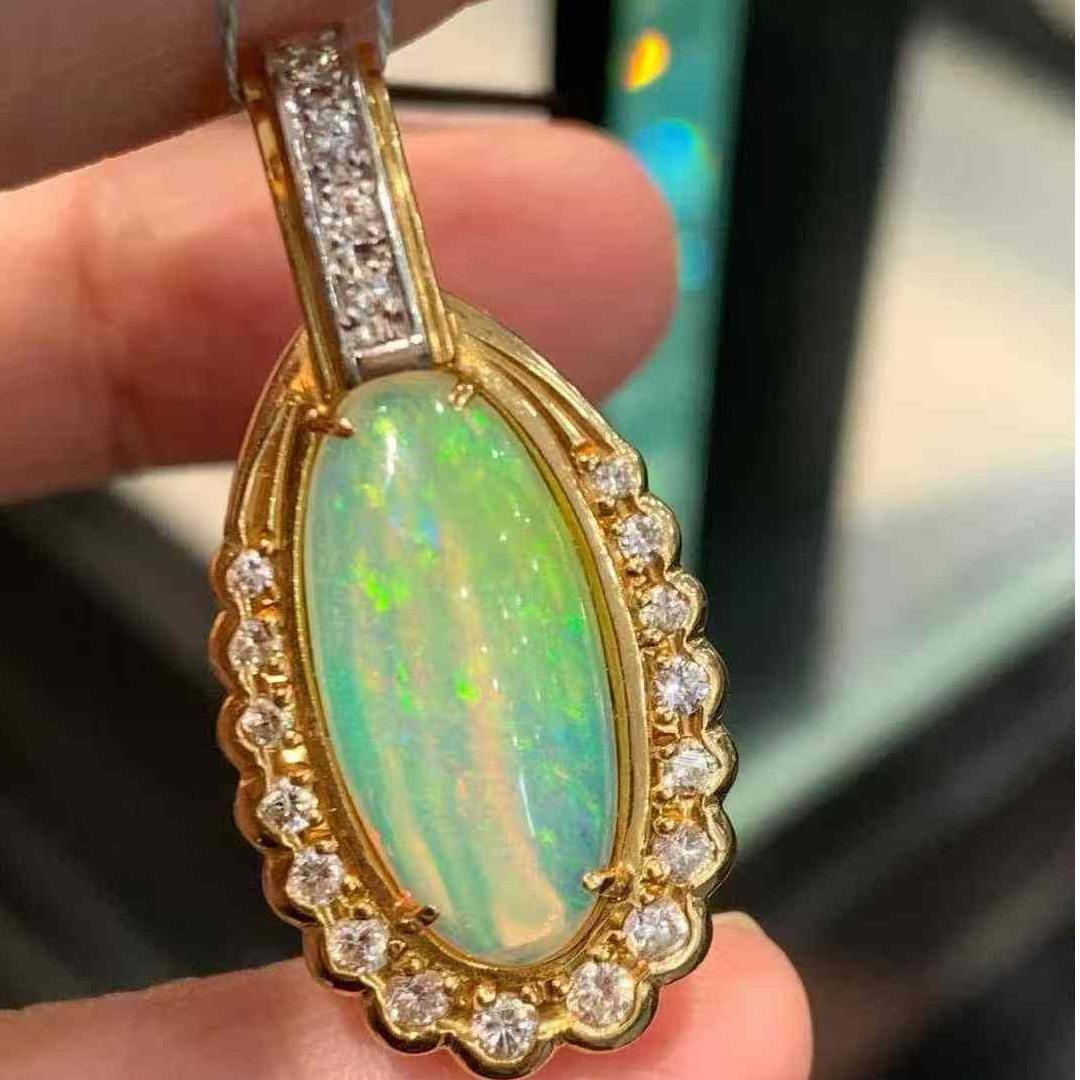 14k Gold 4.53 Ctw Natural Opal & Diamond Pendant( Without Chain ): Ref:231043041 // gold content:14k gold // main gemstone:opal // shape:oval // carat weight:4. 1ct // color:color // treatment:natural // // adjacent gemstone 2 : diamond // shape:round // carat