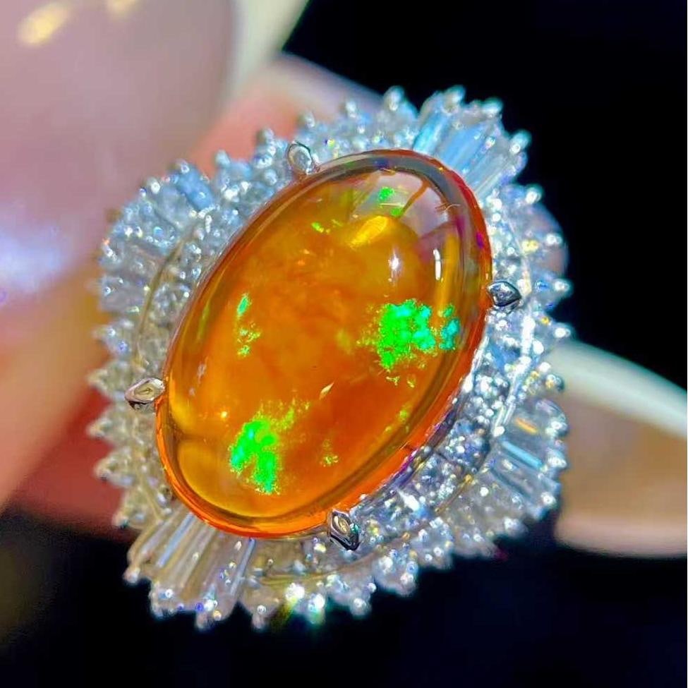 14k Gold 3.96 Ctw Natural Opal & Diamond Ring: Ref:231043042 // gold content:14k gold // ring size:7. 25us // // main gemstone:opal // shape:oval // carat weight:3. 18ct // color:orange // treatment:natural // // adjacent gemstone 2 : diamond //