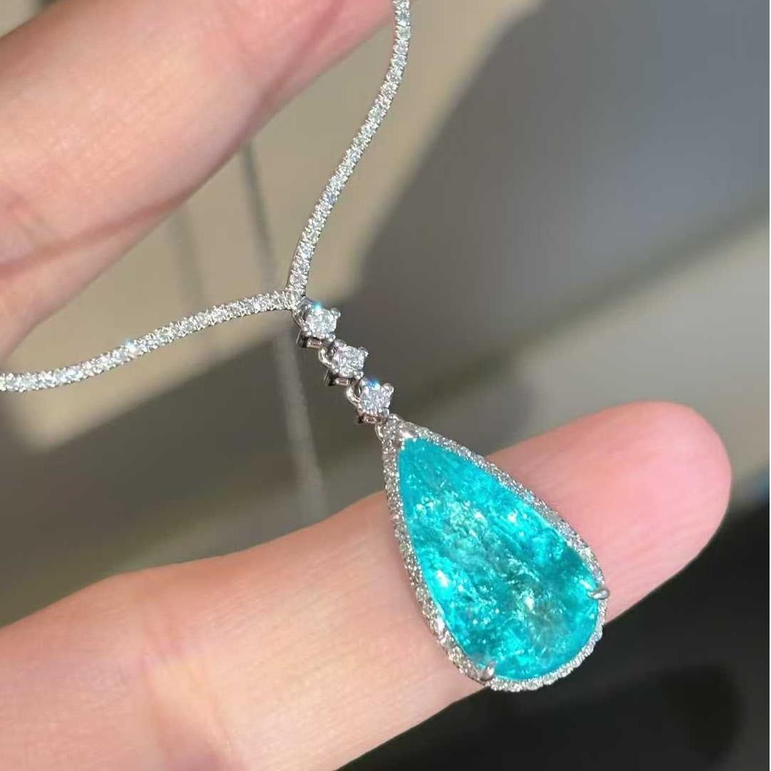 14k Gold 3.33 Ct Natural Paraiba Tourmaline & Diamond Necklace: Ref:231043082 // gold content:14k gold // main gemstone:paraiba tourmaline // shape:pear // carat weight:3. 33ct // color:blue // treatment:natural // // adjacent gemstone 2 : diamond // shape:round /