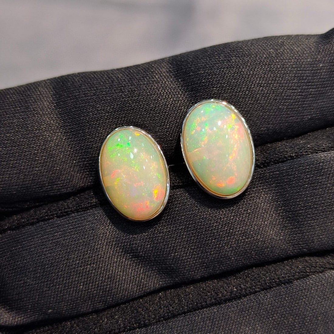 14k Gold 5.39 Ct Natural Opal Earrings: Ref:231043254 // gold content:14k gold // main gemstone:opal // shape:oval // carat weight:5. 39ct // color:color // treatment:natural // Low Estimate: 2400 Condition: New High Estimate: 3600