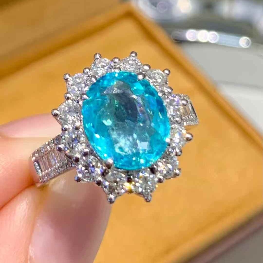 14k Gold 2.23 Ct Natural Paraiba Tourmaline & Diamond Ring: Ref:231043259 // gold content:14k gold // ring size:7. 25us // // main gemstone:paraiba tourmaline // shape:oval // carat weight:2. 23ct // color:blue // treatment:natural // // adjacent gemstone 2 : 