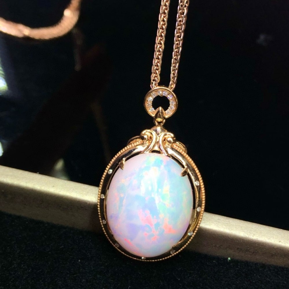 14k Gold 12.85 Ct Natural Opal & Diamond Pendant( Without Chain ): Ref:231044217 // gold content:14k gold // main gemstone:opal // shape:oval // carat weight:12. 85ct // color:color // treatment:natural // // adjacent gemstone 2 : diamond // number of stones:19 //