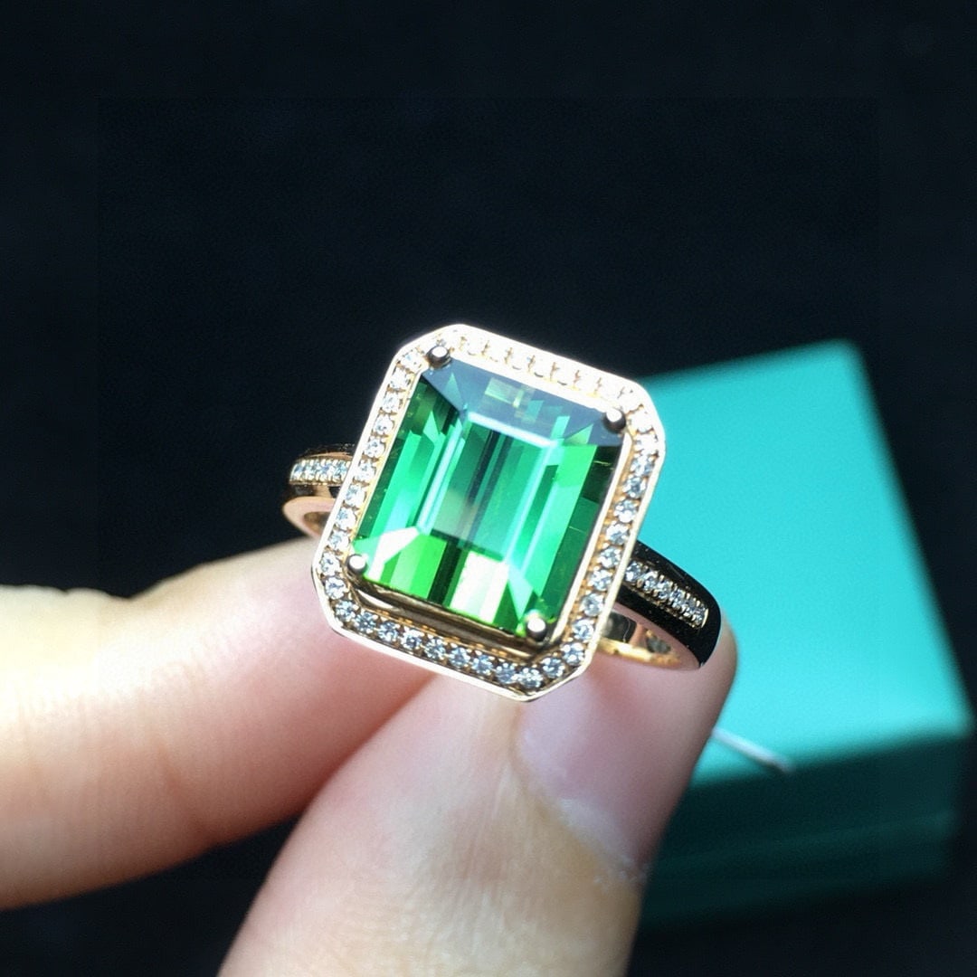 14k Gold 2.7 Ct Natural Tourmaline & Diamond Ring: Ref:231044255 // gold content:14k gold // ring size:7. 25us // // main gemstone:tourmaline // shape:octagonal // carat weight:2. 7ct // color:green // treatment:natural // // adjacent gemstone 2 : dia