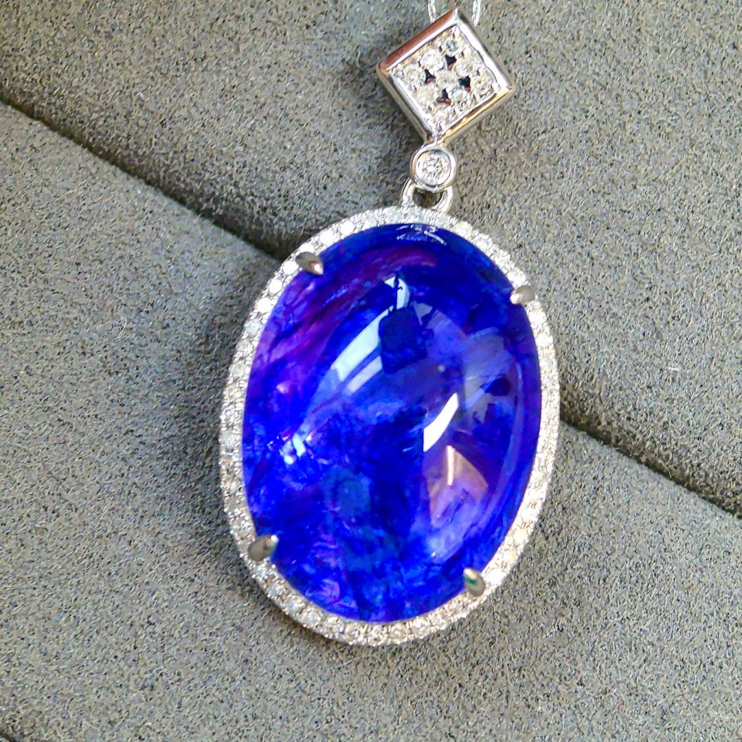 14k Gold 17.47 Ctw Natural Tanzanite & Diamond Pendant( Without Chain ): Ref:231044257 // gold content:14k gold // main gemstone:tanzanite // shape:oval // carat weight:17. 25ct // color:blue // treatment:natural // // adjacent gemstone 2 : diamond // shape:round // carat
