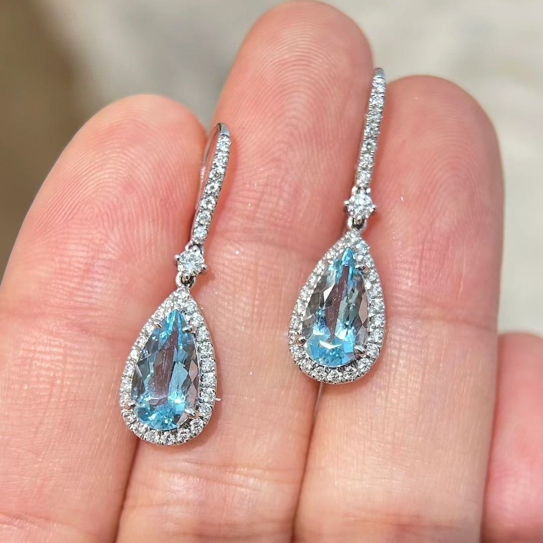 14k Gold 3.27 Ctw Natural Aquamarine & Diamond Earrings: Ref:231044293 // gold content:14k gold // main gemstone:aquamarine // shape:pear // carat weight:2. 64ct // color:blue // treatment:natural // // adjacent gemstone 2 : diamond // shape:round // carat 