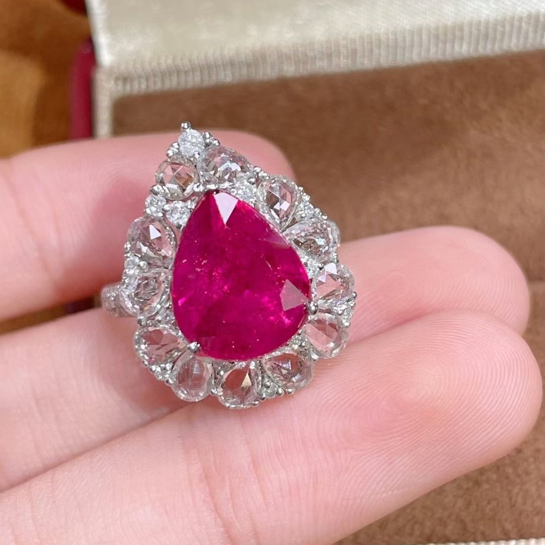 14k Gold 6.50 Ctw Natural Tourmaline & Sapphire Ring: Ref:231044329 // gold content:14k gold // ring size:7. 25us // // main gemstone:tourmaline // shape:pear // carat weight:4. 72ct // color:red // treatment:natural // // adjacent gemstone 2 : sapphire