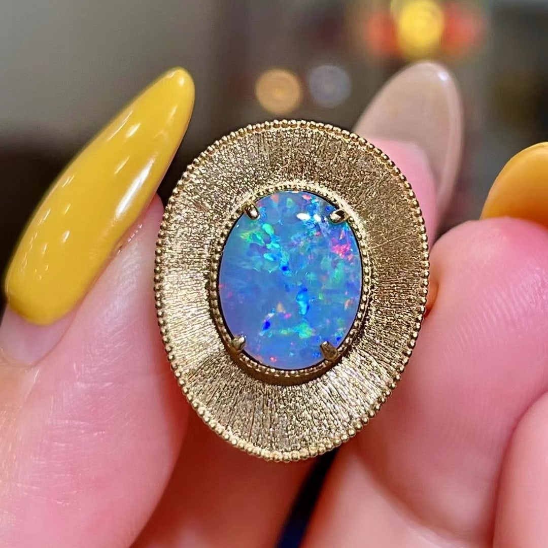 14k Gold 1.55 Ct Natural Opal Ring: Ref:231044339 // gold content:14k gold // ring size:7. 25us // // main gemstone:opal // shape:oval // carat weight:1. 55ct // color:color // treatment:natural // Low Estimate: 7000 Condition: New