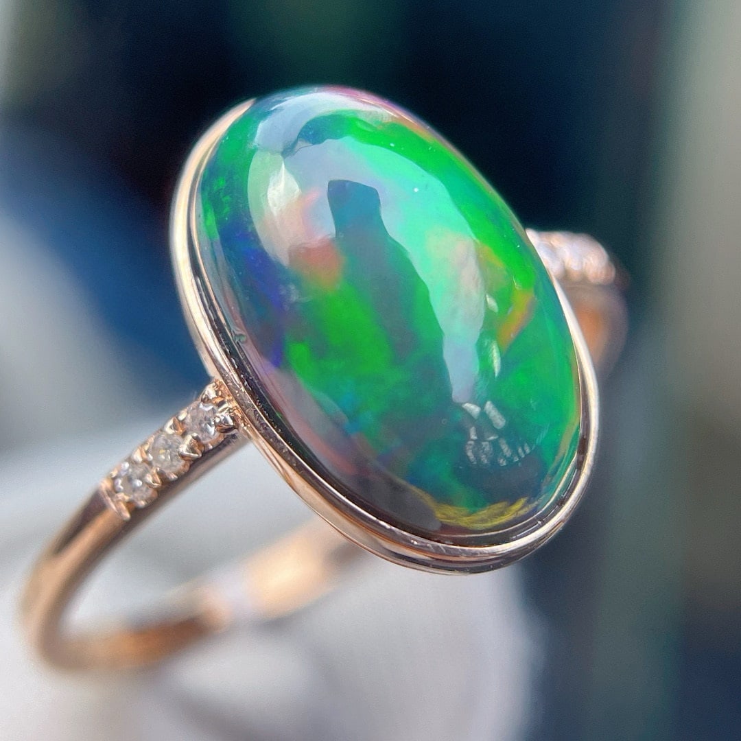 14k Gold 3.33 Ct Natural Opal & Diamond Ring: Ref:231044340 // gold content:14k gold // ring size:7. 25us // // main gemstone:opal // shape:oval // carat weight:3. 33ct // color:color // treatment:natural // // adjacent gemstone 2 : diamond //