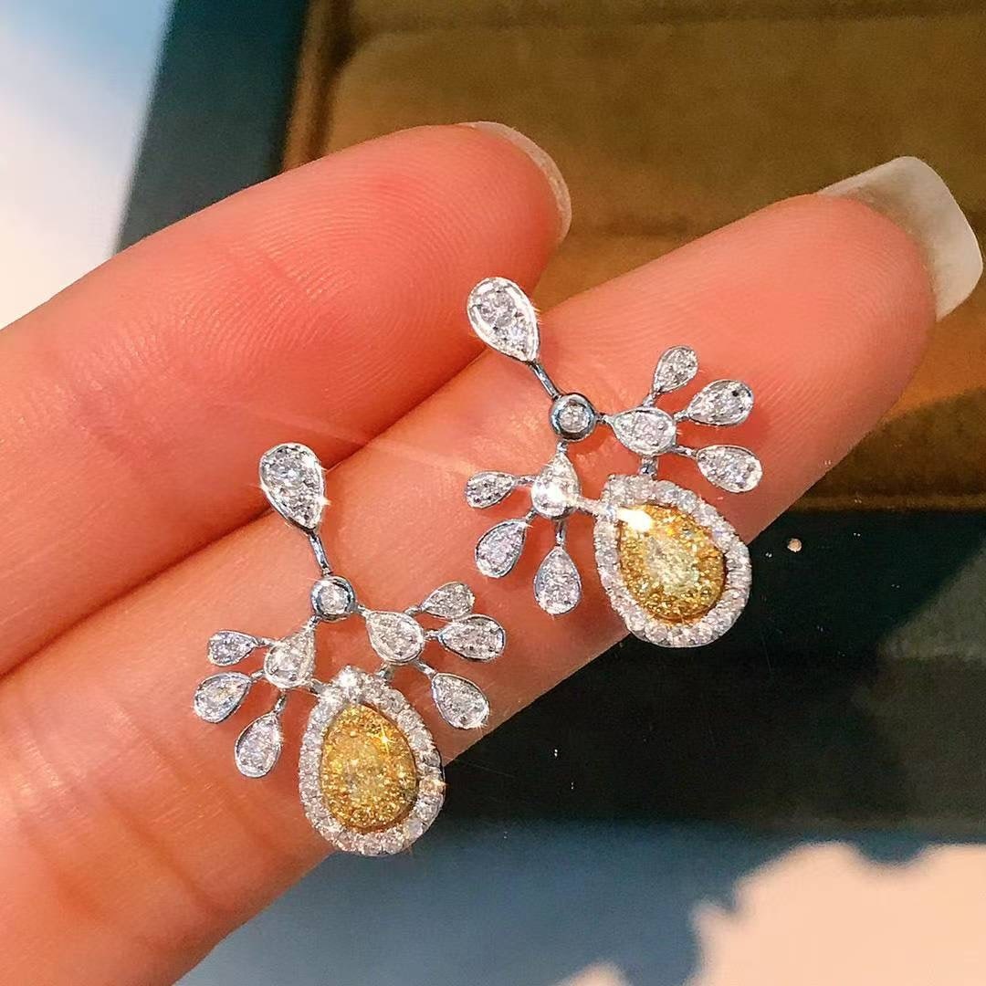 14k Gold 0.7 Ct Natural Color Diamond Earrings: Ref:231044373 // gold content:14k gold // main gemstone:diamond // shape:multiply // carat weight:0. 7ct // clarity grade:vs-si // color:color // treatment:natural // Condition: New Low Estimate: