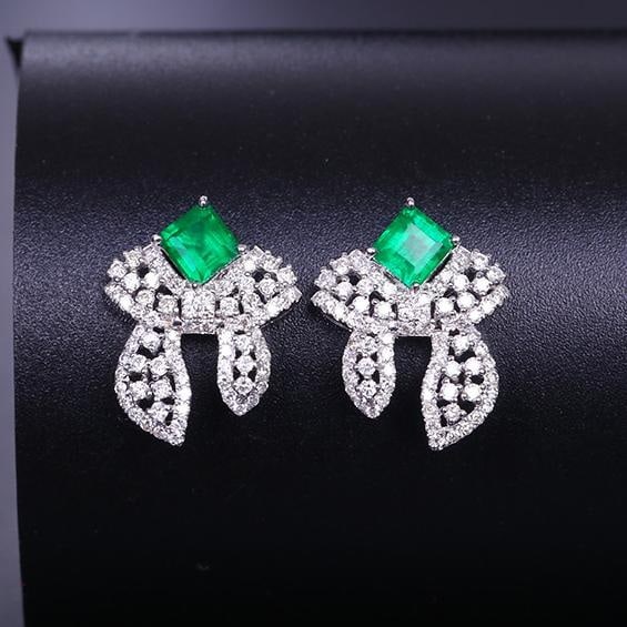 14k Gold 1.20 Ctw Vivid Green Natural Emerald & Diamond Earrings: Ref:231043062 // gold content:14k gold // main gemstone:emerald // shape:octagonal // carat weight:0. 68ct // color:vivid green // treatment:natural // // adjacent gemstone 2 : diamond // shape:round