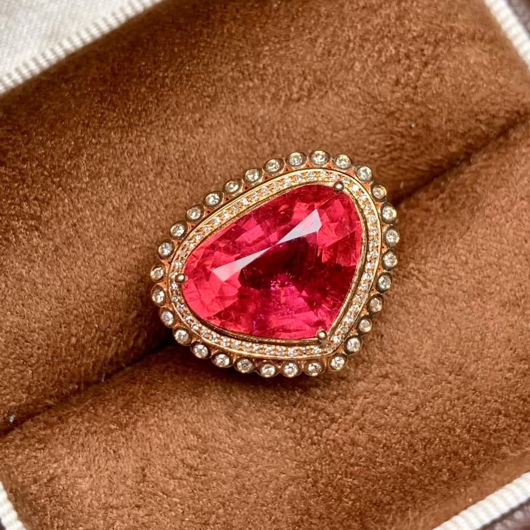 14k Gold 6.39 Ct Natural Tourmaline & Diamond Ring: Ref:231043079 // gold content:14k gold // ring size:7. 25us // // main gemstone:tourmaline // shape:pear // carat weight:6. 39ct // color:red // treatment:natural // // adjacent gemstone 2 : diamond