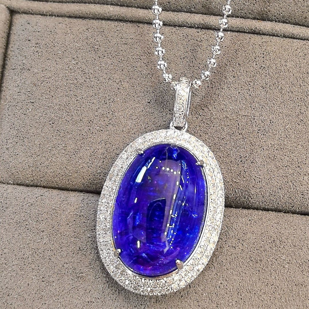 14k Gold 19.15 Ctw Natural Tanzanite & Diamond Pendant( Without Chain ): Ref:231043080 // gold content:14k gold // main gemstone:tanzanite // shape:oval // carat weight:18. 75ct // color:blue // treatment:natural // // adjacent gemstone 2 : diamond // shape:round // carat