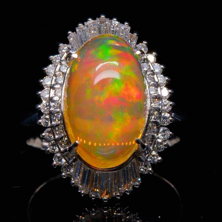 14k Gold 6.77 Ctw Natural Opal & Diamond Ring: Ref:231043116 // gold content:14k gold // ring size:7. 25us // // main gemstone:opal // shape:oval // carat weight:5. 8ct // color:color // treatment:natural // // adjacent gemstone 2 : diamond //