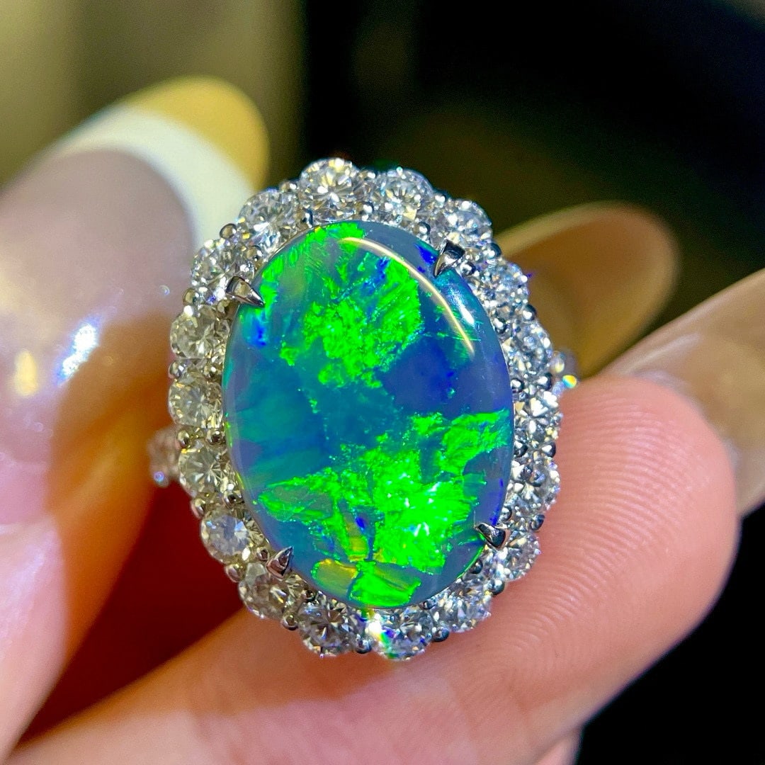 14k Gold 6.40 Ctw Natural Opal & Diamond Ring: Ref:231043161 // gold content:14k gold // ring size:7. 25us // // main gemstone:opal // shape:oval // carat weight:4. 40ct // color:color // treatment:natural // // adjacent gemstone 2 : diamond // sh