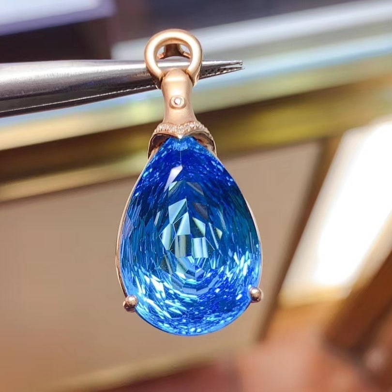 14k Gold 26.91 Ct Natural Topaz & Diamond Pendant( Without Chain ): Ref:231043187 // gold content:14k gold // main gemstone:topaz // shape:pear // carat weight:26. 91ct // color:blue // treatment:natural // // adjacent gemstone 2 : diamond // shape:round // clarity